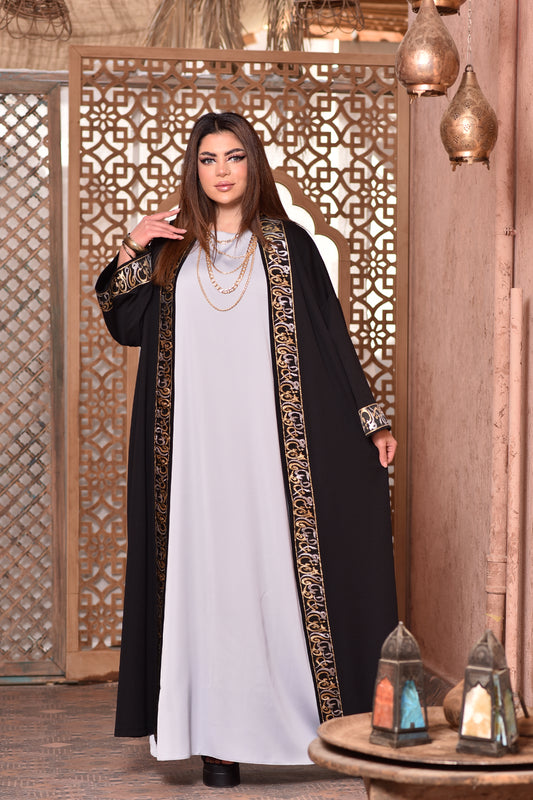 The black kaftan x gold kufic letters